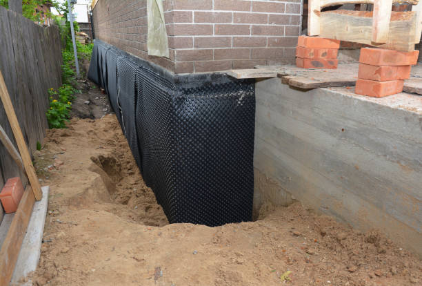 Happy homeowners after waterproofing job in White Lake